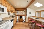 Kitchen looks out to treetop views